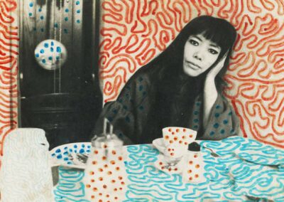 Photo of herself at a table, marked by Kusama (1967)
